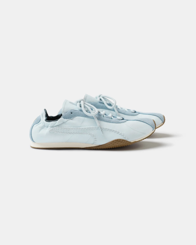 PUMA Low-Profile Sneakers – Pale Blue & White with Yellow Heel Accents