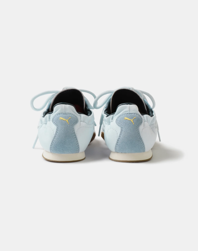 PUMA Low-Profile Sneakers – Pale Blue & White with Yellow Heel Accents